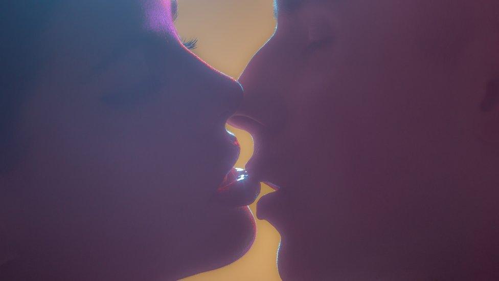 Two people kissing