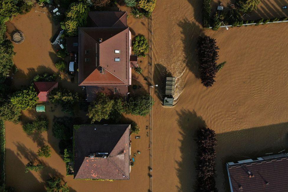 An aerial view of an army truck driving throught flooded streets while delivering aid days after the Nysa Klodzka river overcame the river banks on September 19, 2024 in Lewin Brzeski, Poland. 