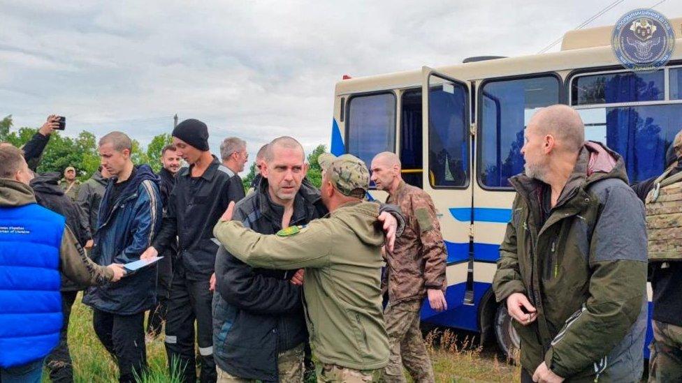 Ukrainian prisoners of war (POW) are seen after a swap, amid Russia's attack on Ukraine, at an unknown location in Ukraine, in this handout picture released June 11, 2023