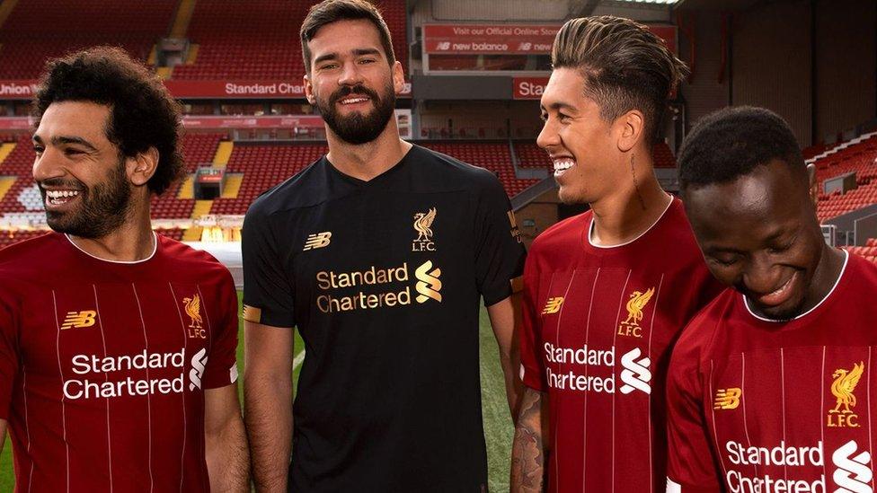 Salah-Allison-Firmino-Mane-modelling-Liverpool-jersey.