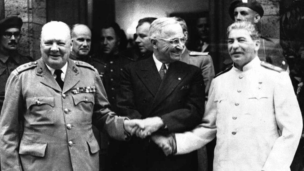 Winston Churchill shakes hands with Harry S Truman and Josef Stalin, Potsdam, 23 July 1945