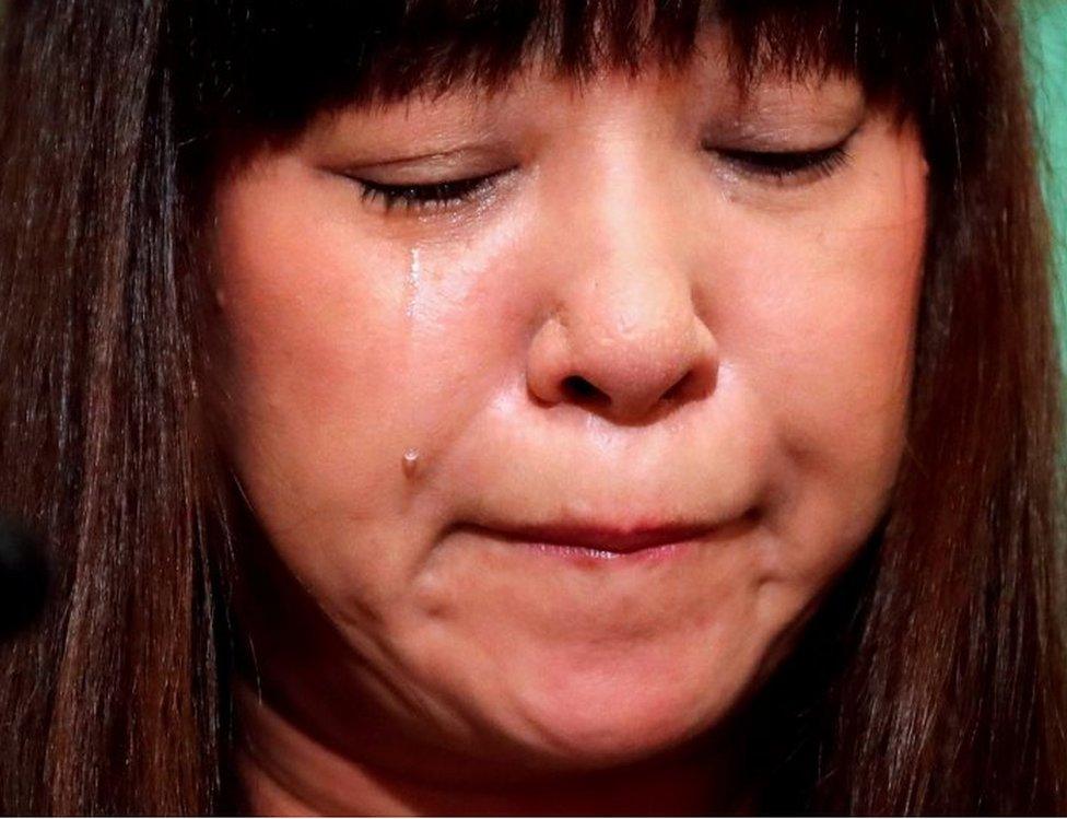 Myu, the wife of Japanese freelance journalist Jumpei Yasuda, who has been held by militants in Syria for three years, attends a news conference after a video of her husband pleading for help surfaced recently at Japan National Press Club in Tokyo, Japan August 7, 2018.