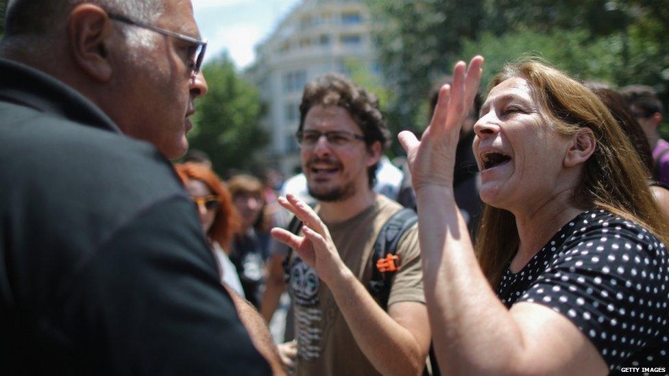 Anti-austerity protester argues in Athens with local man