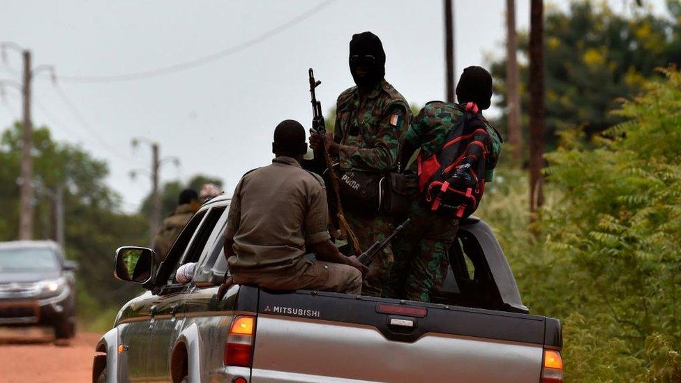 Mutinous Ivory Coast soldiers patrol at the entrance of the Ivory Coast's central second city Bouake, on May 14, 2017.