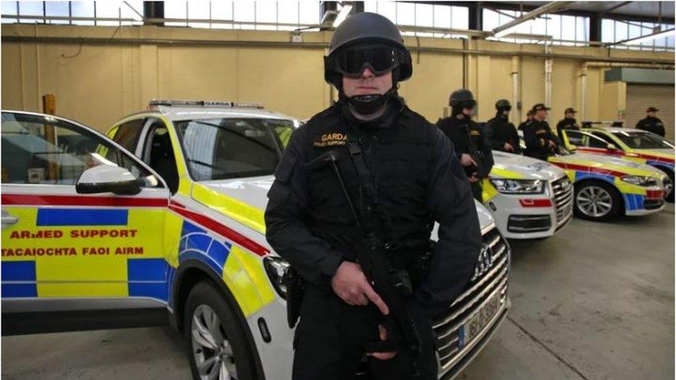 Gardai with vehicles