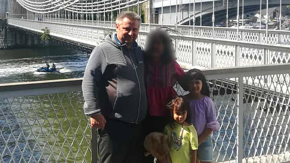 Bartlomiej Kuczynski, 45, a woman, 12-year-old-Jasmin Kuczynska, and Natasha Kuczynska, aged nine, near a river bridge