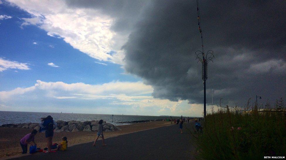 Dark clouds over a beachfront
