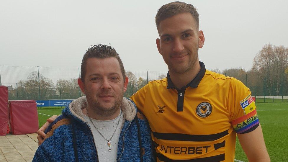 Newport County fan Adam Smith pictured with club captain Mickey Demetriou