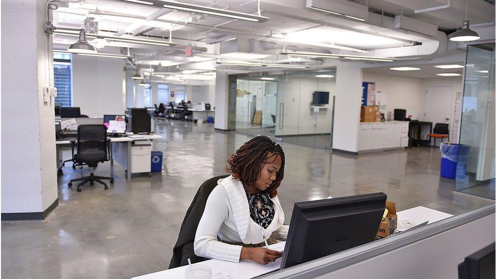 Woman works at desk