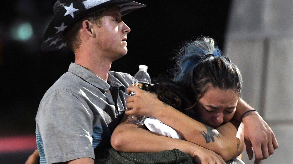 Concert-goers comfort each other in Las Vegas on 1 October 2017