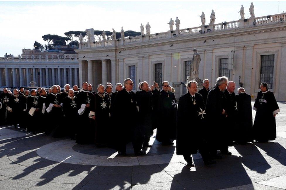 Members of the Order of the Knights of Malta arrive in St. Peter Basilica for their 900th anniversary at the Vatican February 9, 2013.