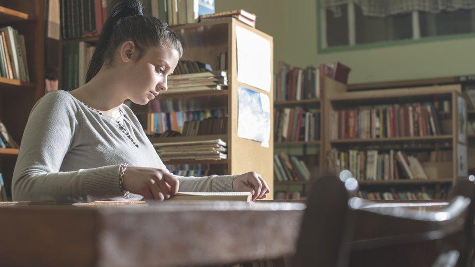 Young woman in library