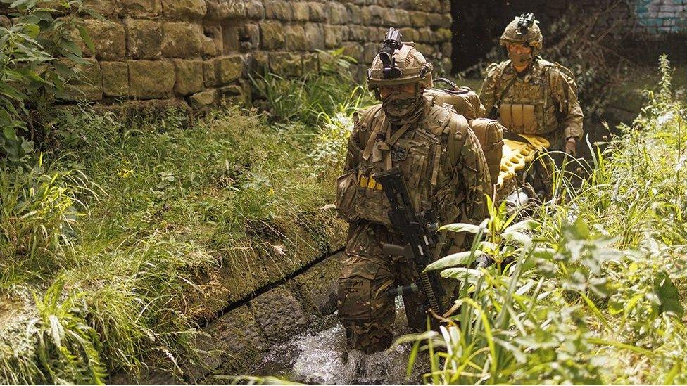 Soldiers carrying a stretcher