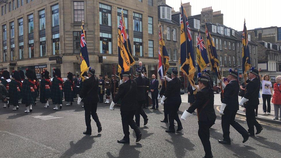 servicemen and women march through central Edinburgh for the annual Armed Forces Day