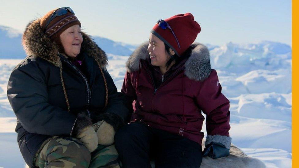 Inuit family on sea ice