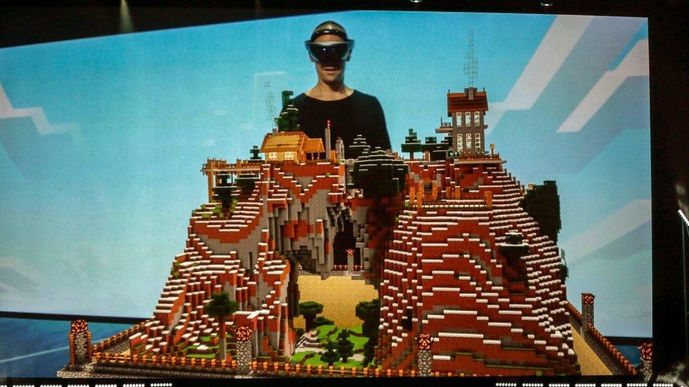 Microsoft Studios executive Saxs Persson demonstrates how the HoloLens is used to play 'Minecraft' at the Xbox E3 2015 briefing