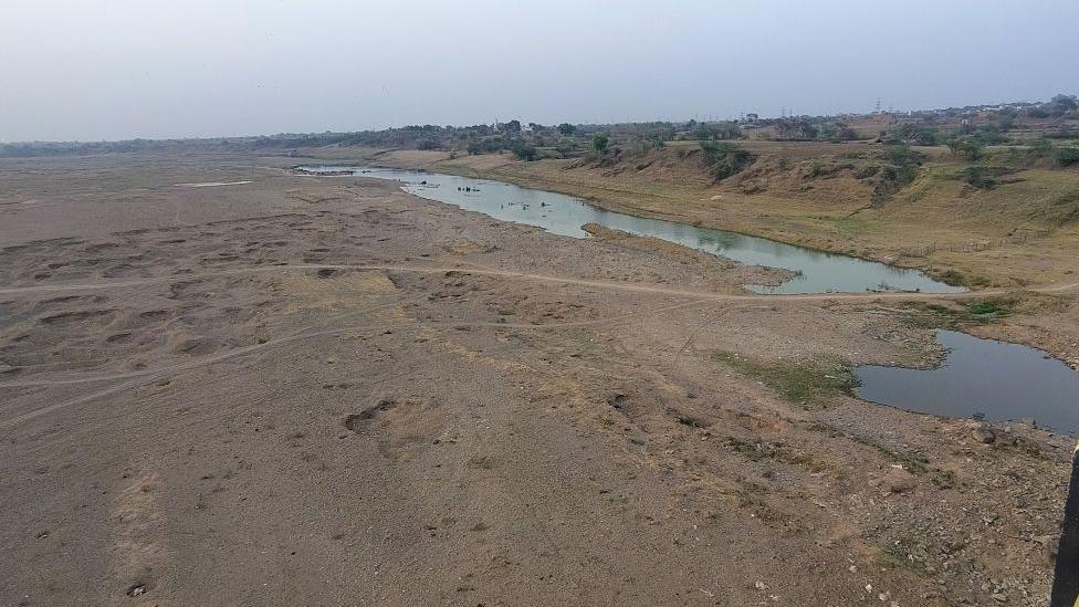 A wide angle shot of the Ken river as it flows through the dusty lands of Banda