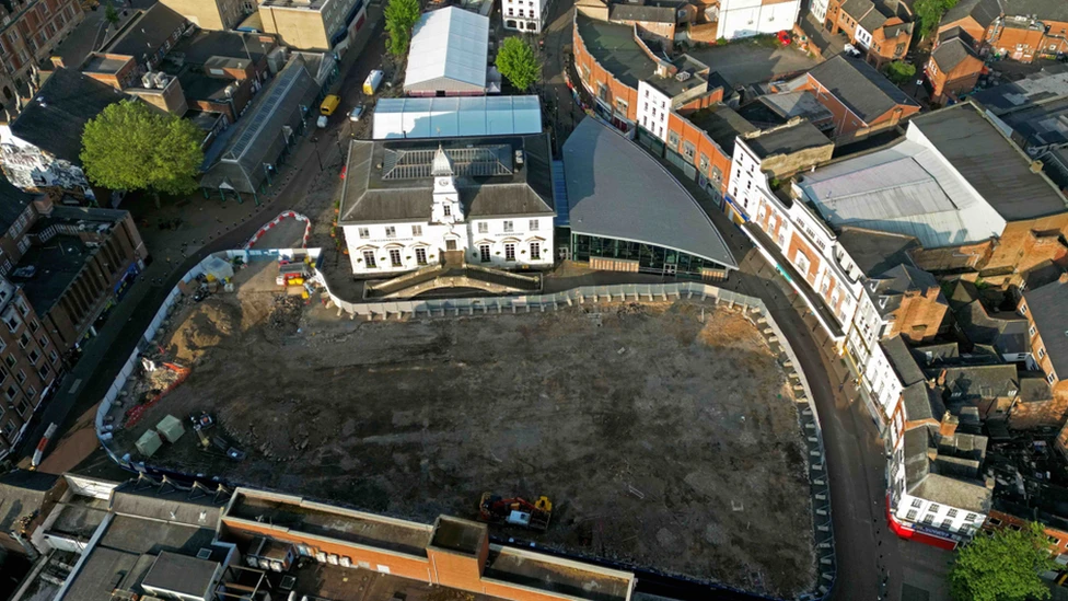 An aerial view of the market place in Leicester with the site cleared and fenced off