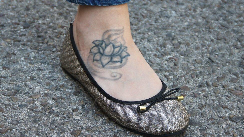 Estela Martín's lotus flower tattoo