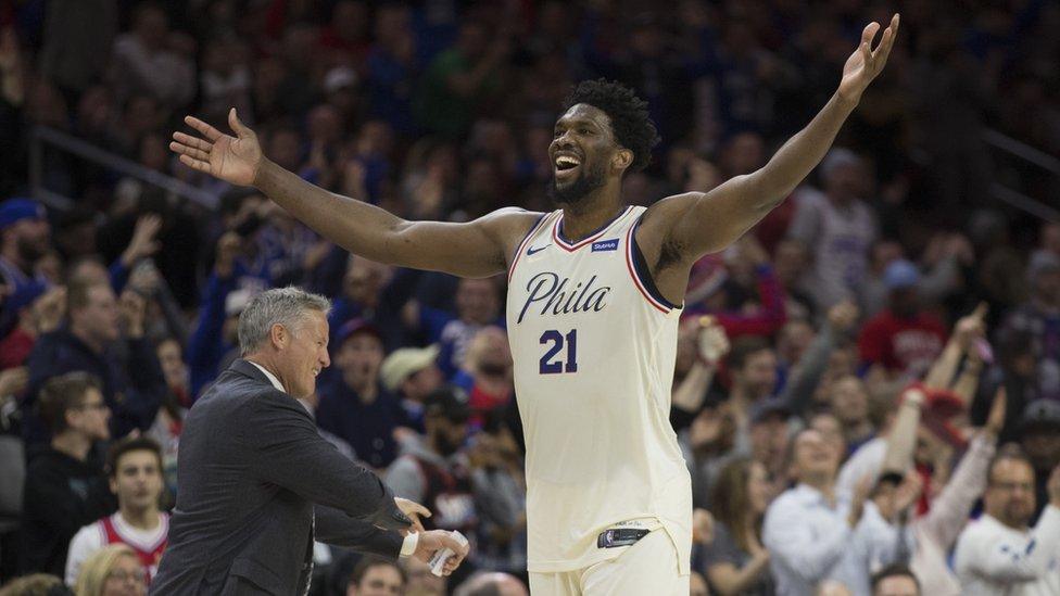 Joel Embiid celebrates for Sixers