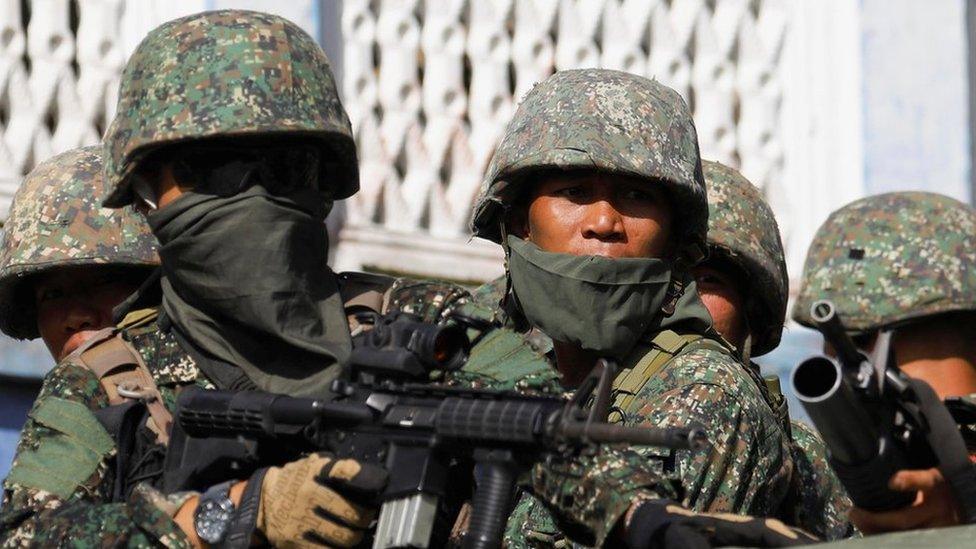 Members of Philippine Marines are pictured aboard a vehicle as more soldiers reinforce to fight the Maute group in Marawi City in southern Philippines 29 May 2017.