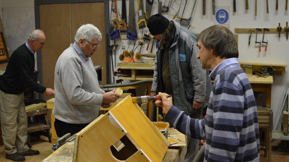 Men working in their shed