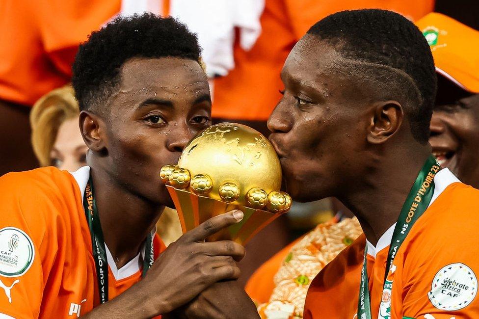 Ivory Coast celebrate after receiving the Afcon trophy on Sunday night.