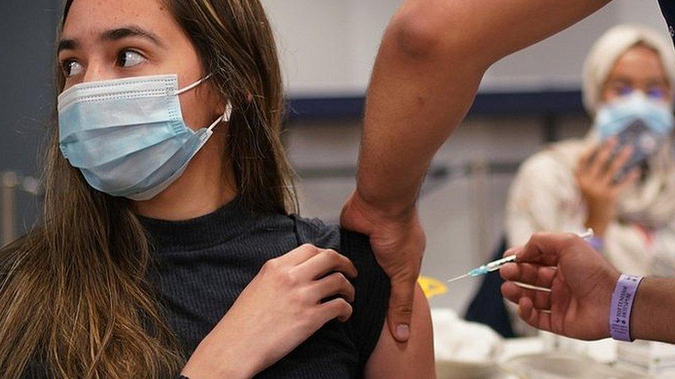 A teenager is vaccinated