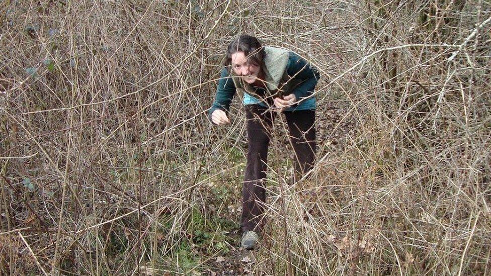 Caroline walking through brambles