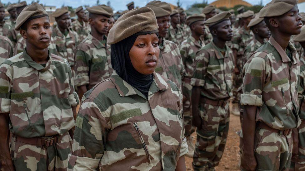 Soldiers, including female ones, belonging to Somalia's elite Danab force stand to attention