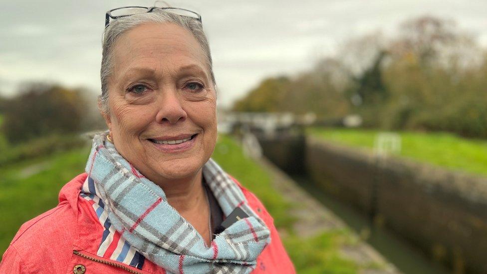 Boater, Kate Areogast, standing at a lock in Devizes