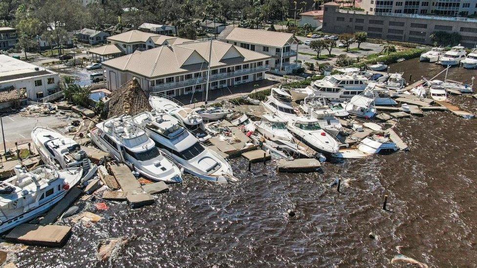 An overhead image of damaged boats from Hurricane Ian.