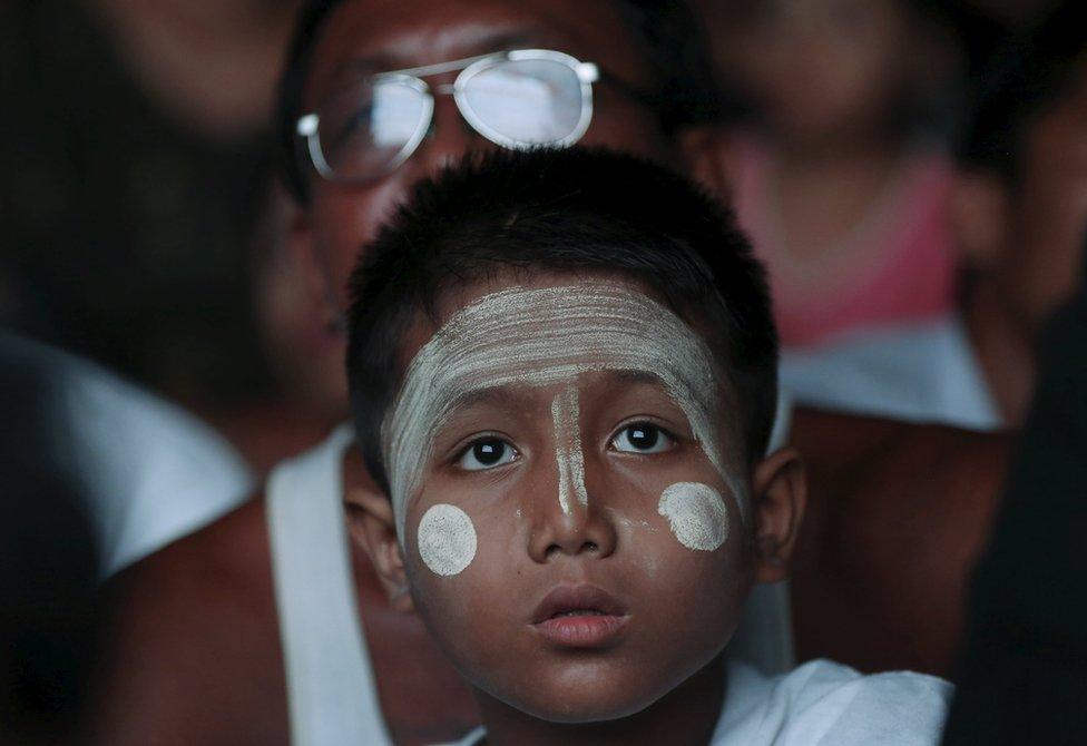 Supporters of opposition leader Aung San Suu Kyi watch results come in on a TV monitor at the National League for Democracy (NLD) offices in Mandalay, Myanmar, 9 November 2015