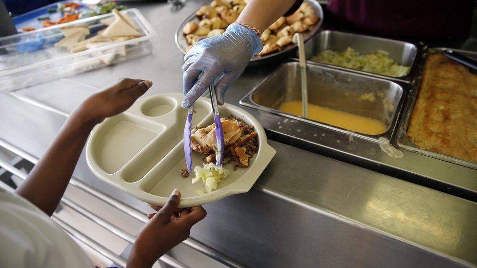 Pupil receiving school lunch