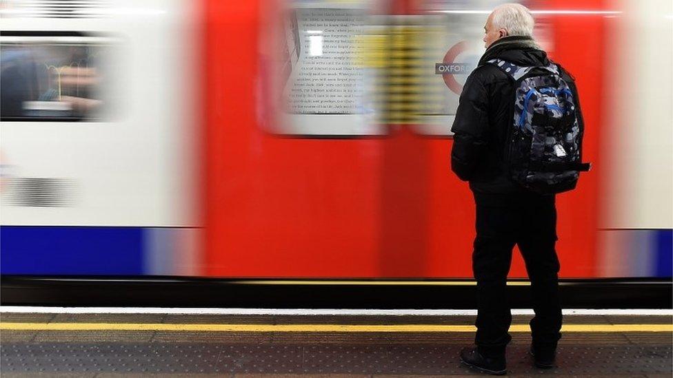 Commuter waiting for Tube train