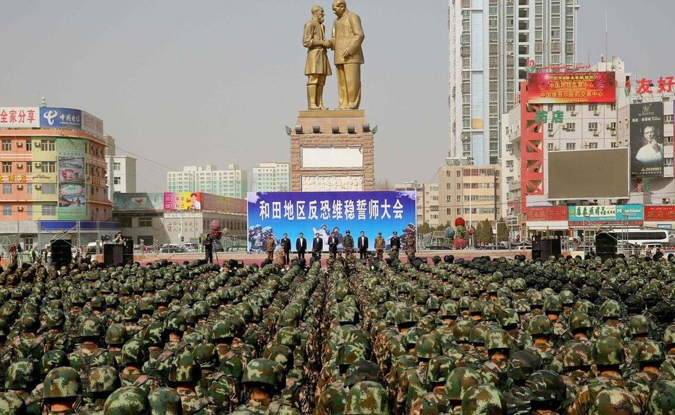 This photo taken on 27 February 2017 shows ranks of Chinese military police attending an anti-terrorist oath-taking rally in Hetian, northwest China's Xinjiang region.