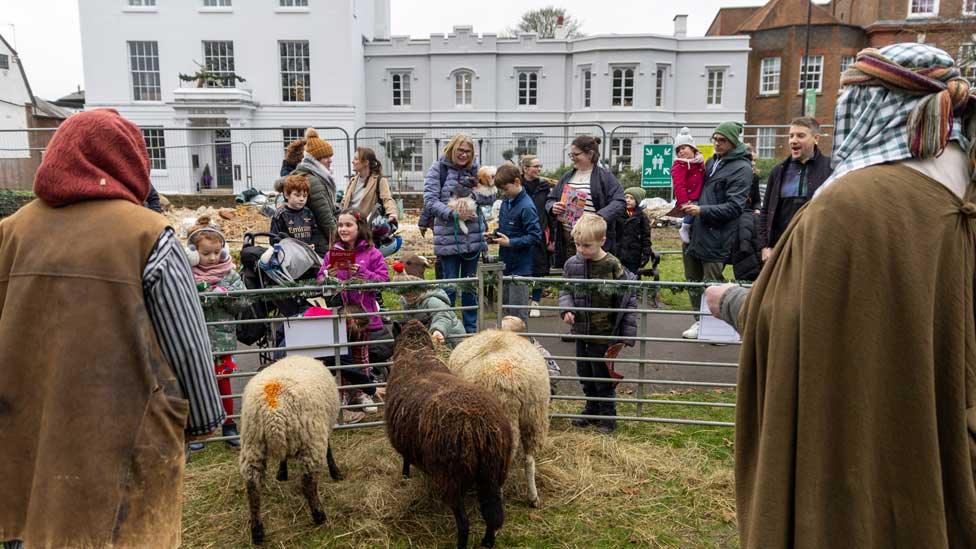 Shepherds and sheep in the live nativity at St Albans Cathedral