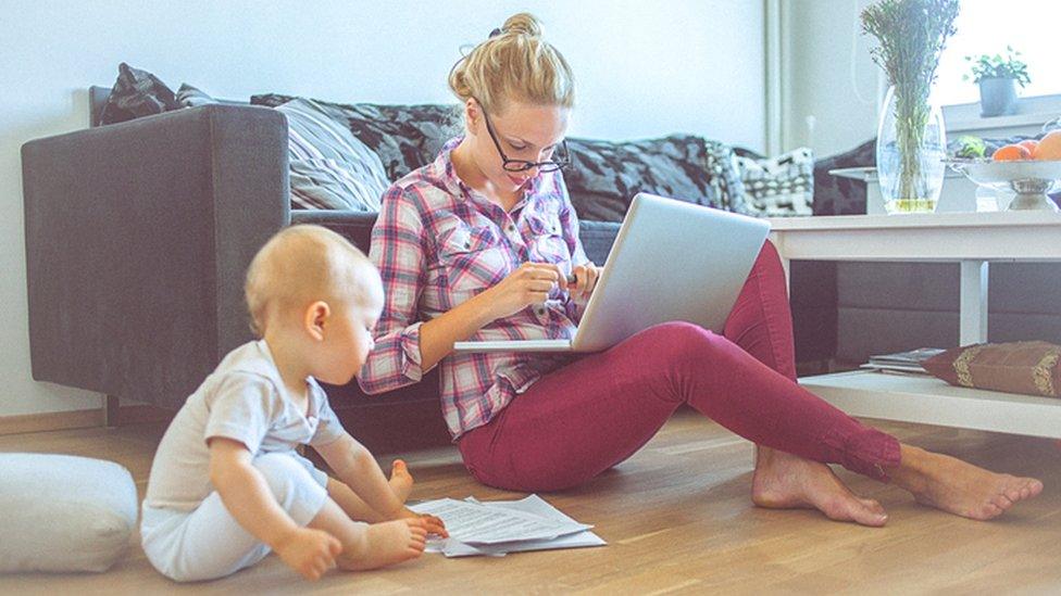 Woman with computer and child