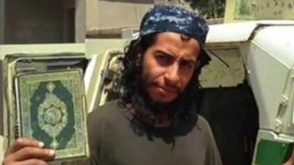 Abdelhamid Abaaoud with Koran (grab from Islamic State video, date and location unknown)