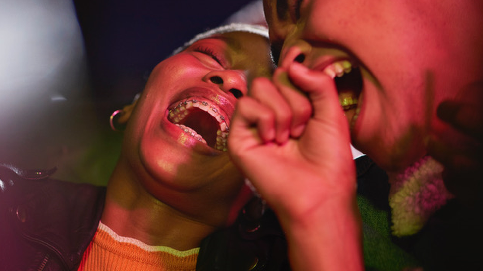 Woman and boy laughing