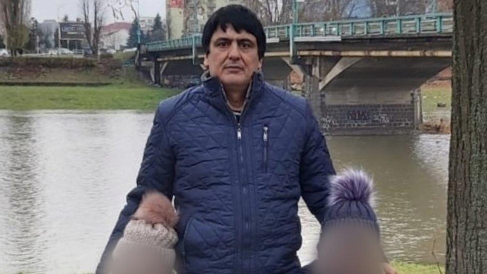 Mir Safi and two of his children in Ukraine