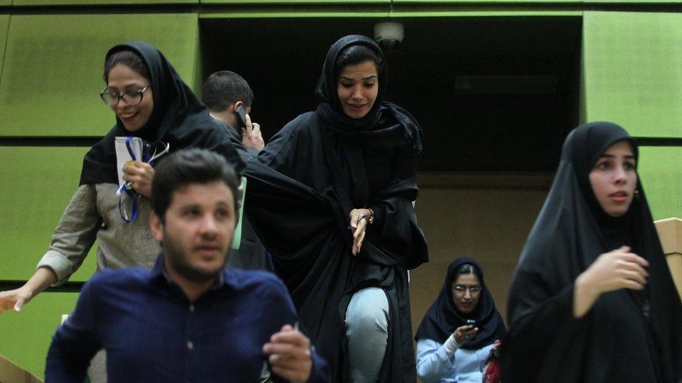 Women are seen inside the Iranian parliament during an attack in central Tehran (7 June 2017)