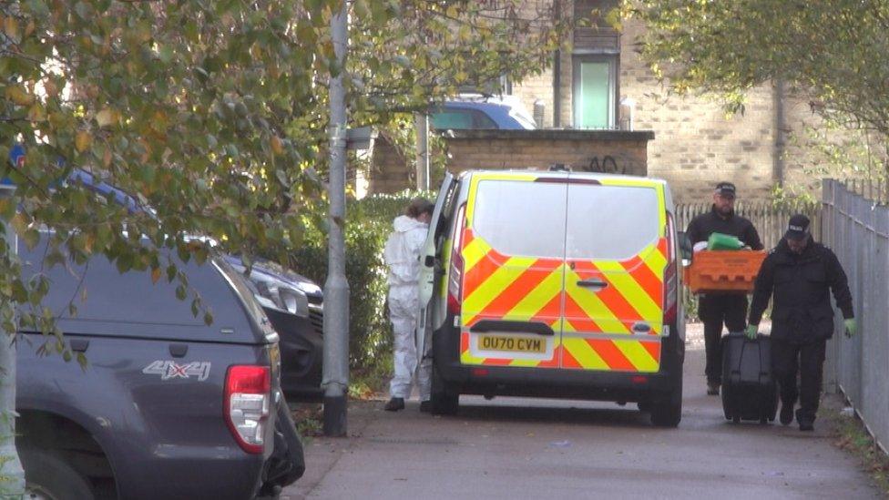 Police by the scene of a stabbing in Cambridge