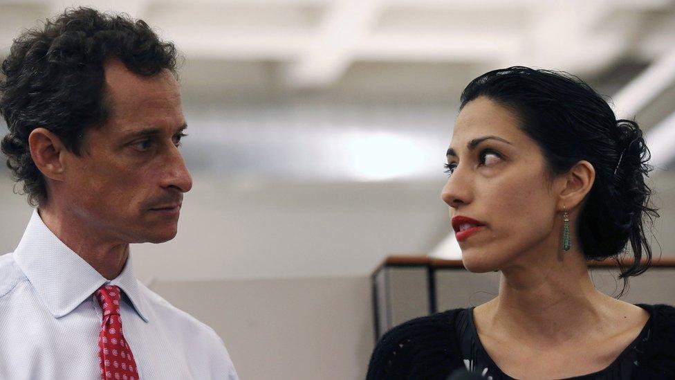 Weiner and Abedin stand together at a press conference