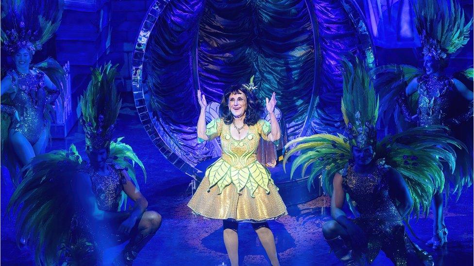 Lesley Joseph on stage as "the spirit of the beans"