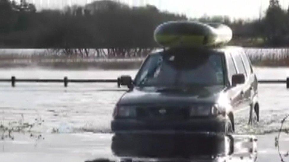 The Halpin family has bought a dinghy and a 4X4 vehicle to get through floods outside their home