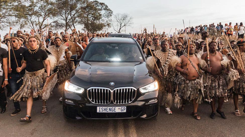 Zulu regiments sing and chant praises in front of a convoy carrying the coffin of Mangosuthu Buthelez on its to Ulundi - Friday 15 September 2023