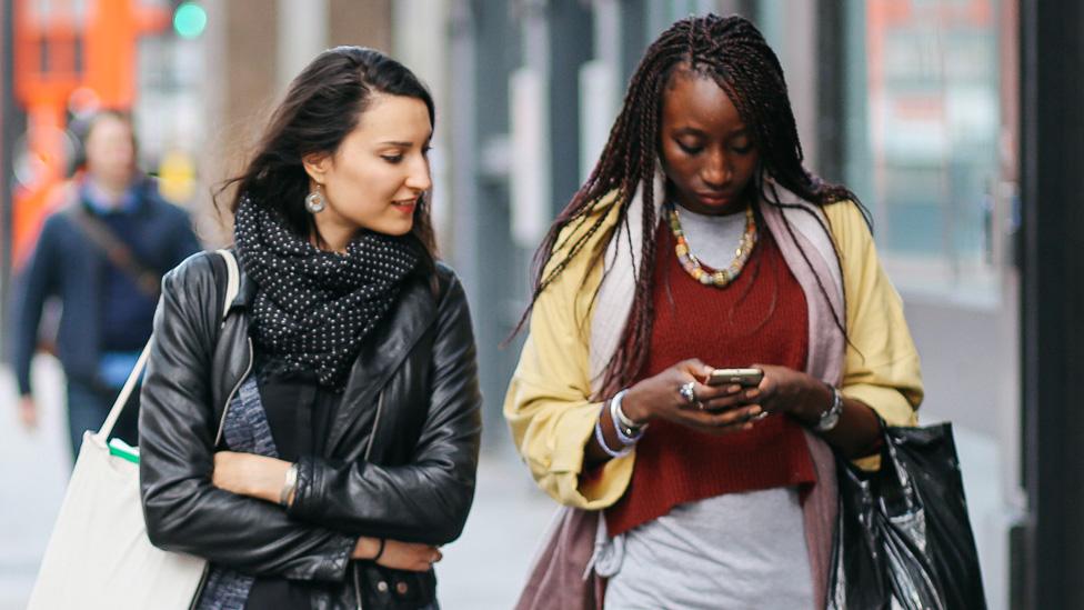 Two women walking