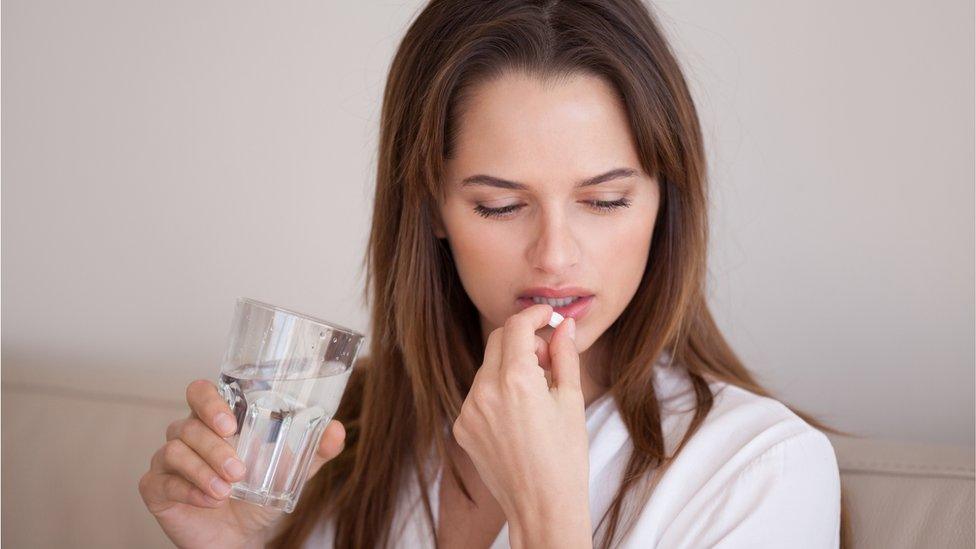 Woman taking an antidepressant