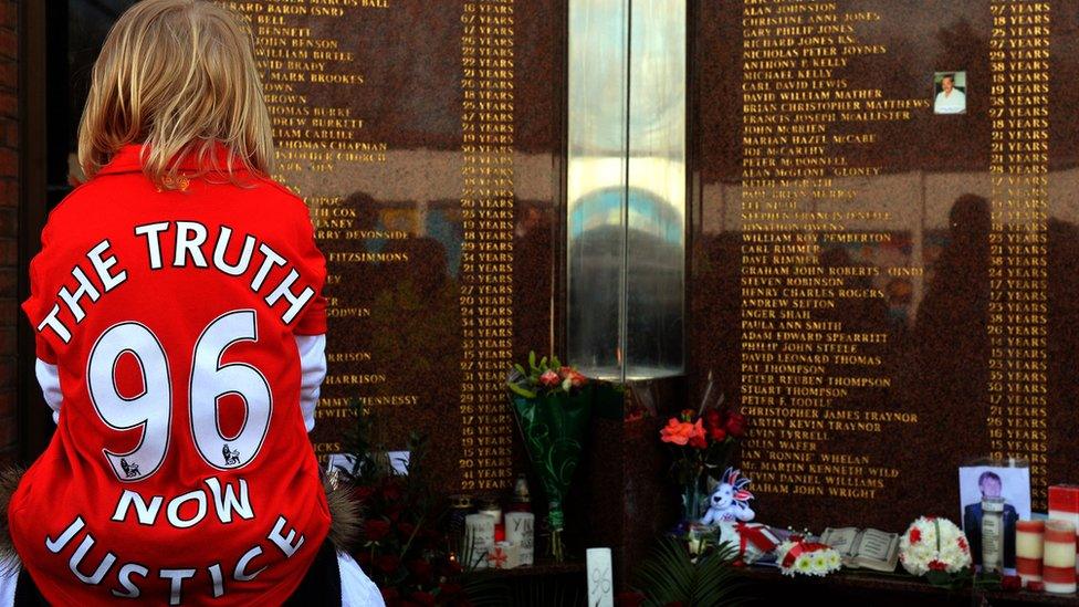 A young Liverpool fan at the Hillsborough memorial at Anfield